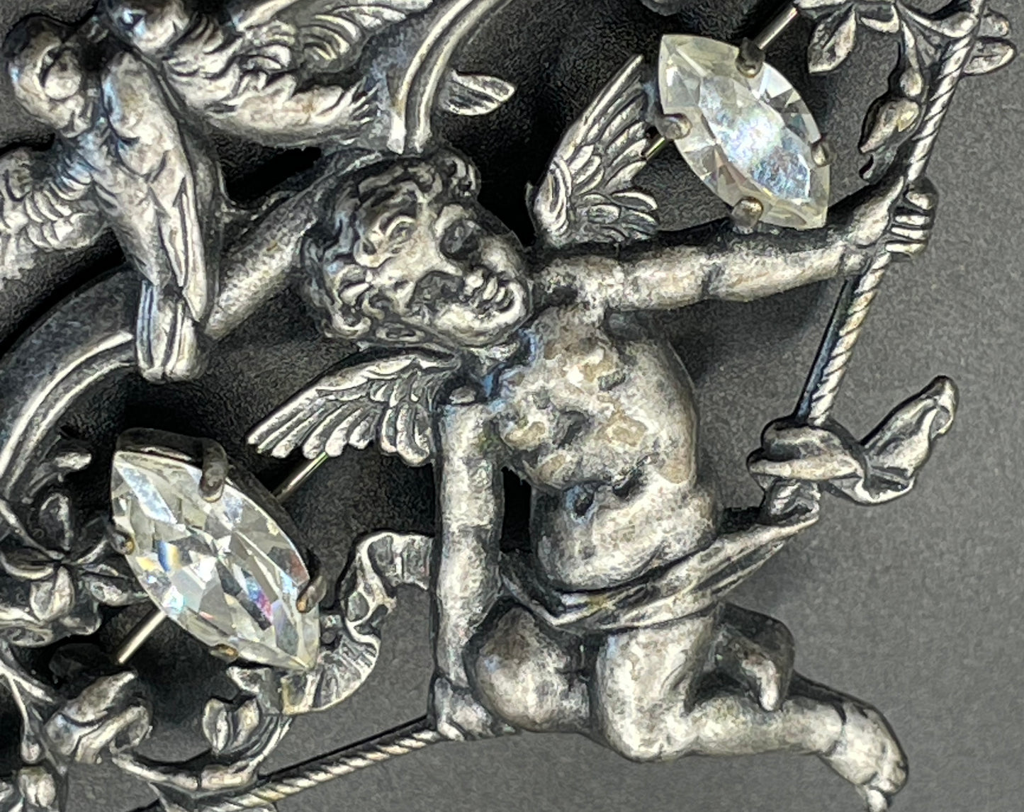 Large early Askew London, vintage cupid brooch in antique silver tone with marquise cut clear rhinestones, cherub / putti & love bird design