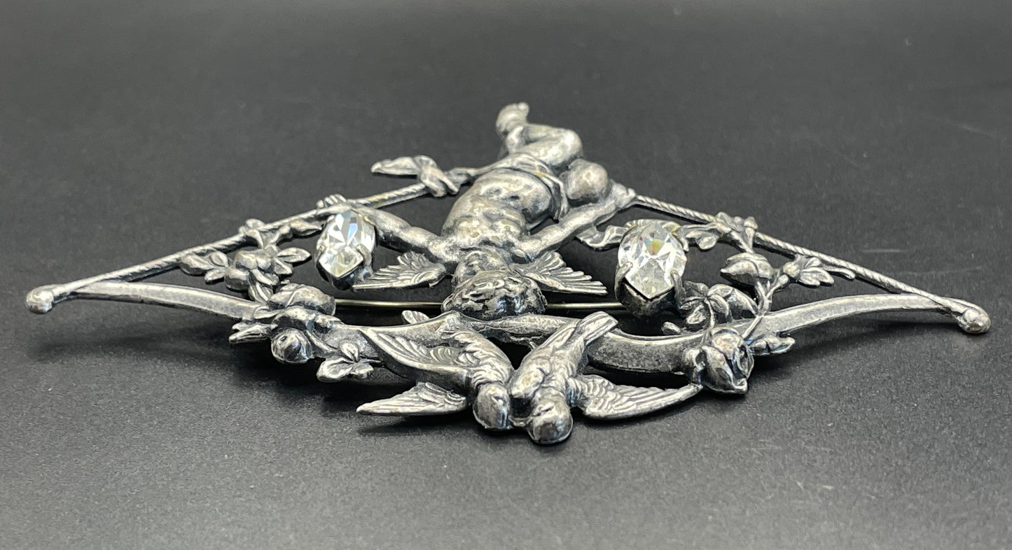 Large early Askew London, vintage cupid brooch in antique silver tone with marquise cut clear rhinestones, cherub / putti & love bird design