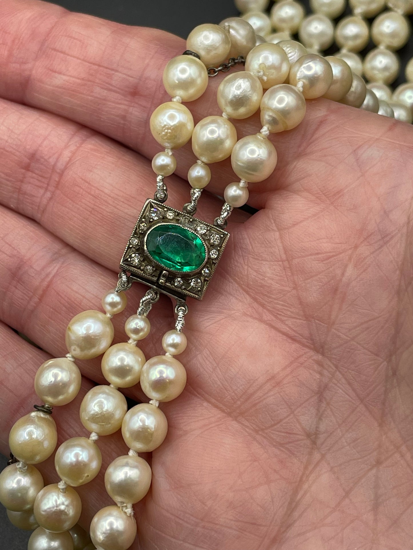 Antique / vintage real cultured pearl triple strand necklace, hand-knotted, in box, pretty silver with emerald green & clear paste box clasp
