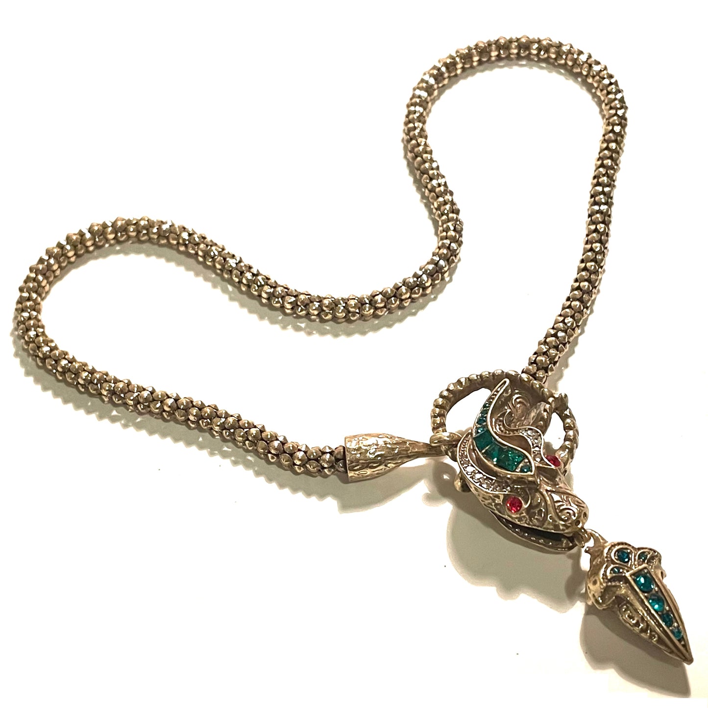 Vintage costume copy of opulent Victorian snake, serpent or dragon design lariat necklace, gold tone with red, green and clear rhinestones