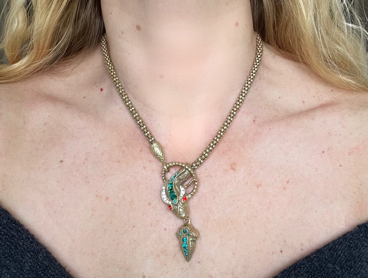 Vintage costume copy of opulent Victorian snake, serpent or dragon design lariat necklace, gold tone with red, green and clear rhinestones