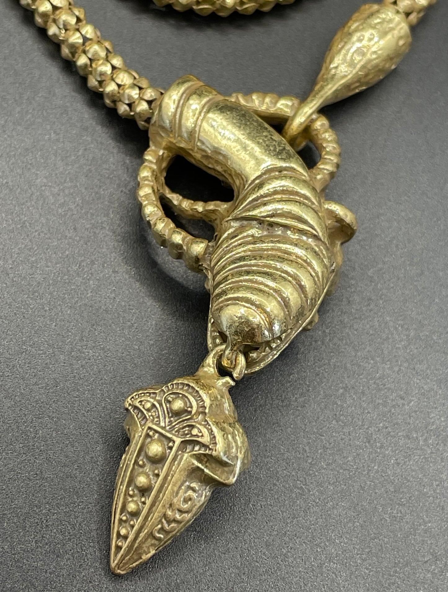 Vintage costume copy of opulent Victorian snake, serpent or dragon design lariat necklace, gold tone with red, green and clear rhinestones