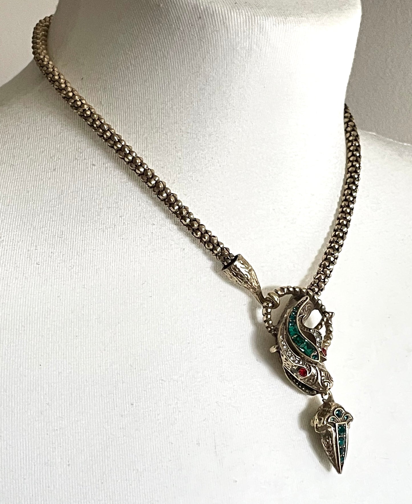 Vintage costume copy of opulent Victorian snake, serpent or dragon design lariat necklace, gold tone with red, green and clear rhinestones