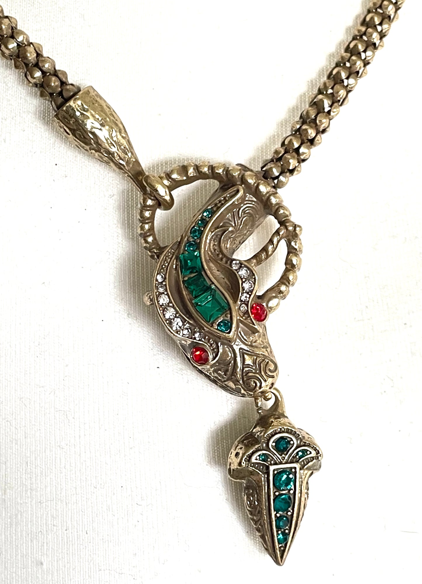Vintage costume copy of opulent Victorian snake, serpent or dragon design lariat necklace, gold tone with red, green and clear rhinestones
