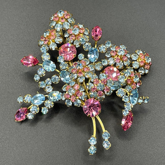Large vintage Austrian crystal pink and blue rhinestone flower bouquet brooch in gold tone, signed 'Austria'