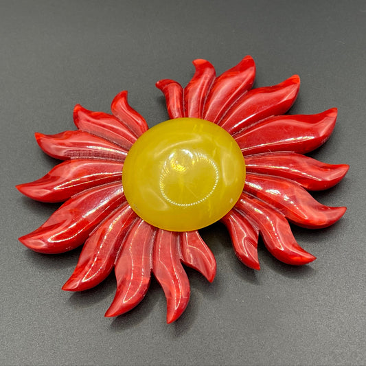 Vintage Art Deco galalith buckle with striking flame design and vibrant yellow, orange and red colours, can be worn as a statement pendant
