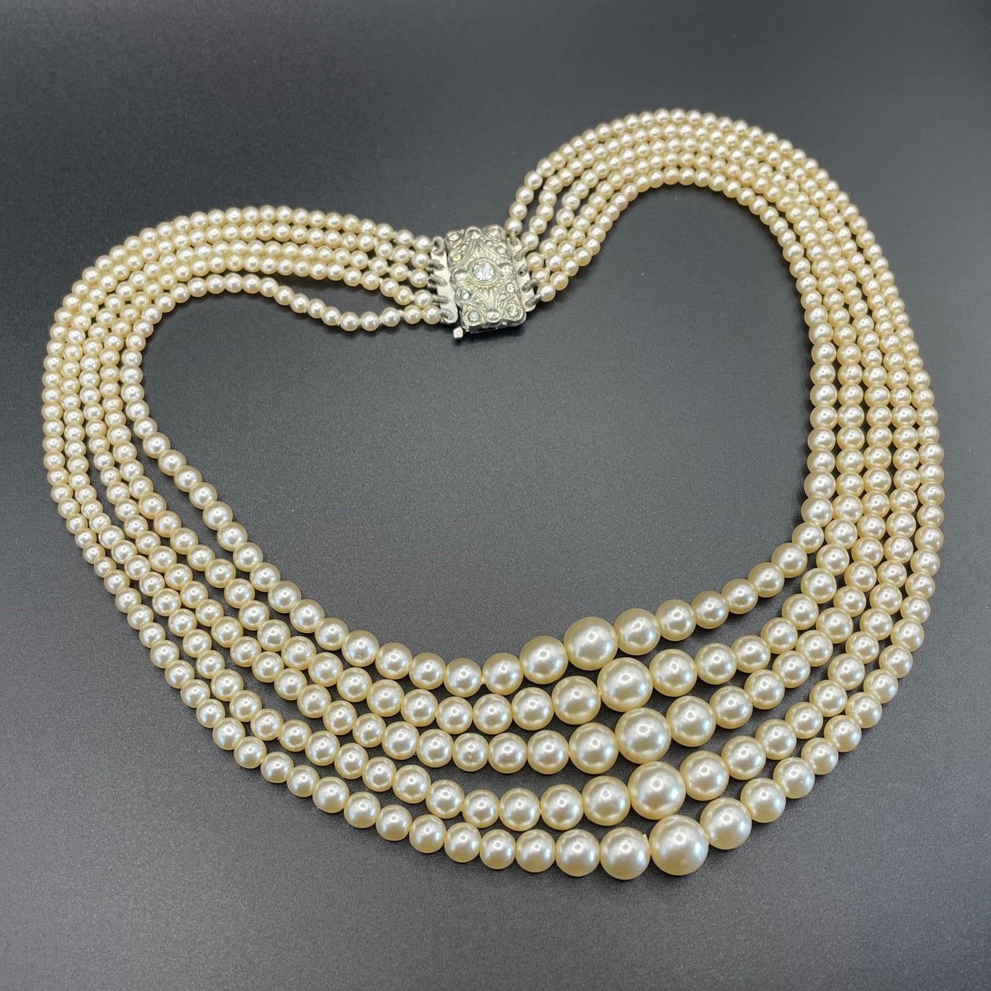 Vintage five strand glass faux pearl necklace with ornate clear rhinestone box clasp, graduated glass pearls