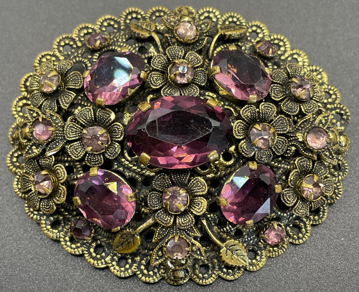 Large vintage Neiger style Art Deco amethyst purple glass rhinestone Czech brooch in antique gold tone filigree, floral design