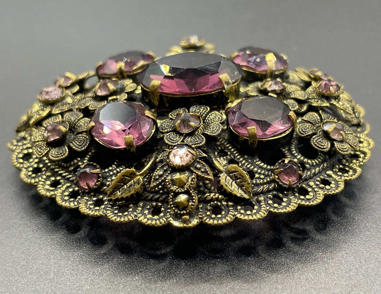 Large vintage Neiger style Art Deco amethyst purple glass rhinestone Czech brooch in antique gold tone filigree, floral design