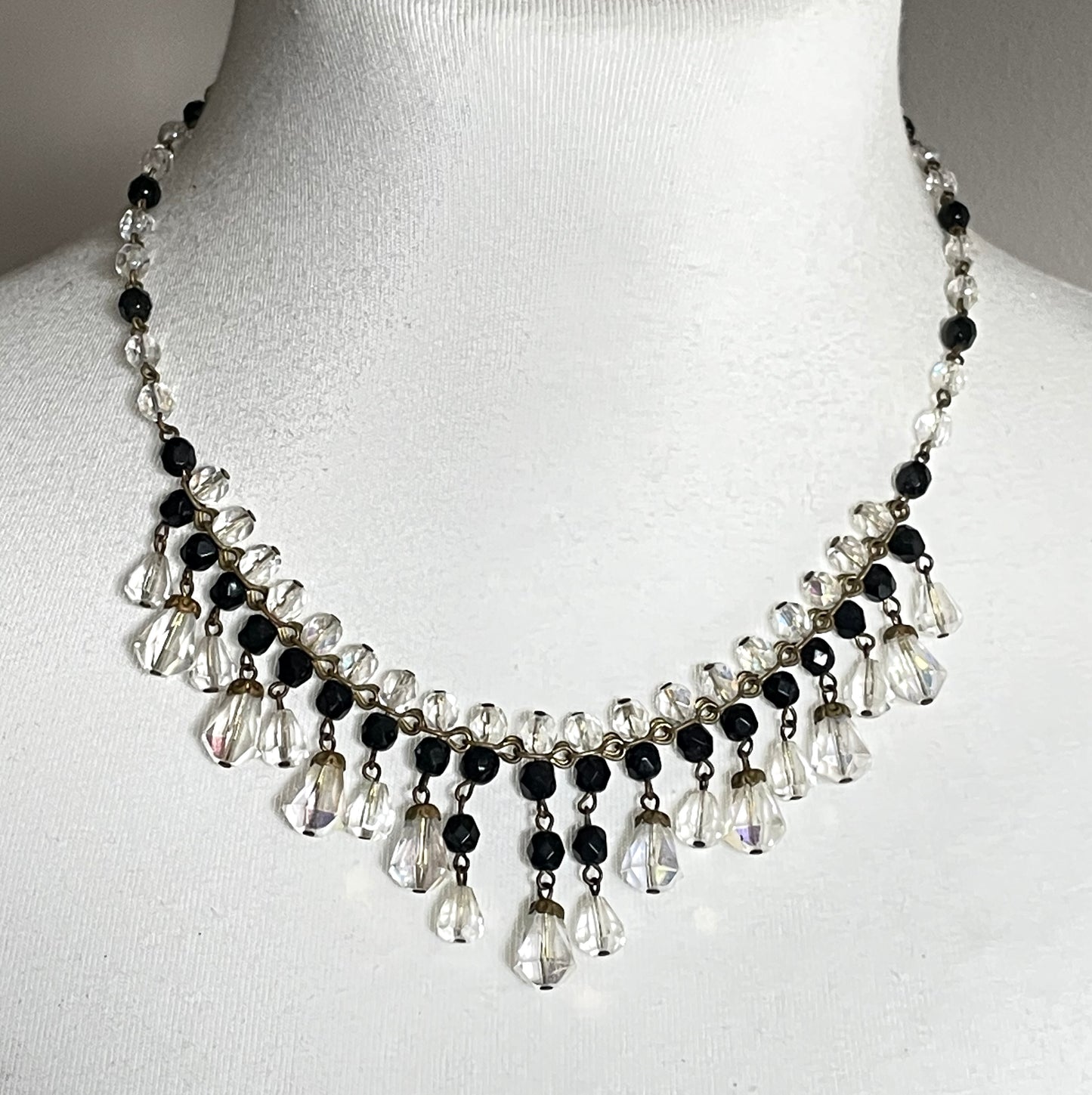 Vintage black and clear aurora borealis crystal faceted cut glass beaded fringe necklace with gold tone, delicate monochrome design