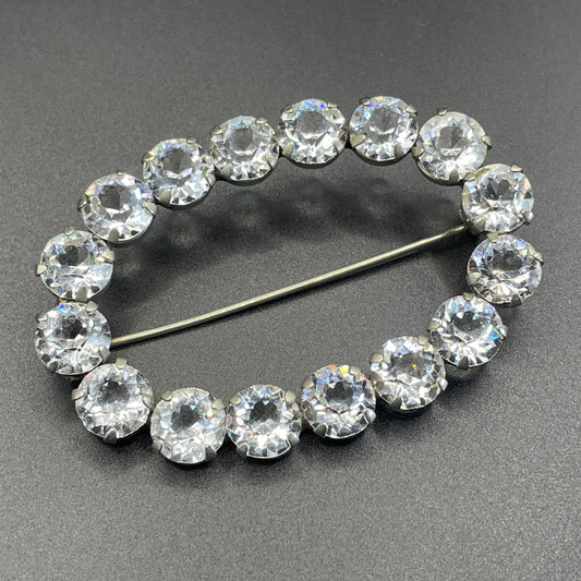 Large antique Victorian to Edwardian ice clear paste crystal rhinestone oval ring brooch with open backed stones, set in silver tone