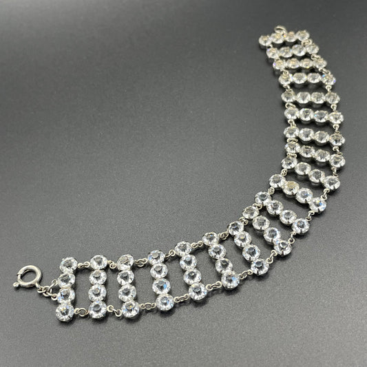 Vintage ice clear paste Art Deco tennis cocktail bracelet with rhinestone set open-backed in silver tone
