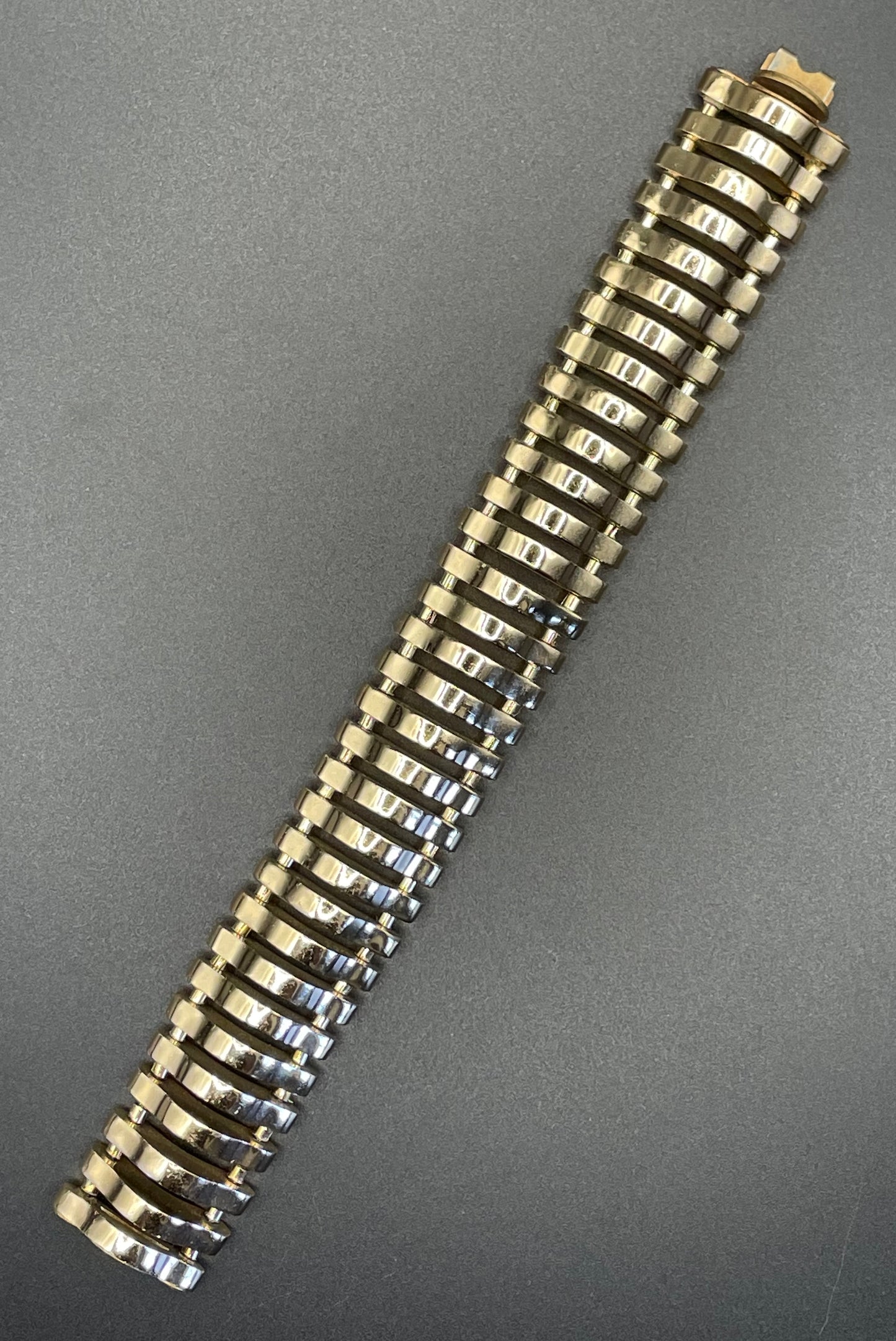 Vintage Art Deco machine age geometric architectural gold tone cuff bracelet, articulated tank track design