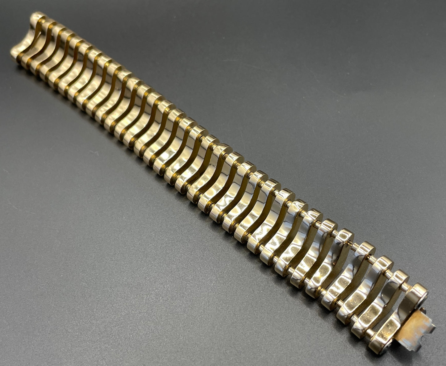 Vintage Art Deco machine age geometric architectural gold tone cuff bracelet, articulated tank track design