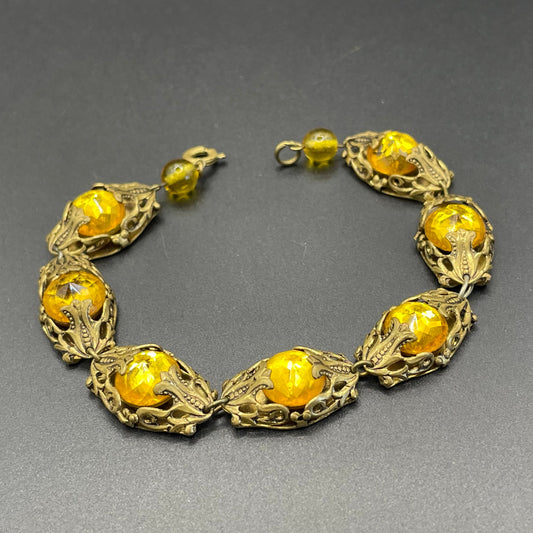 Vintage Czech filigree panel bracelet with bright yellow / orange Vauxhall glass type faceted rhinestone antique gold tone
