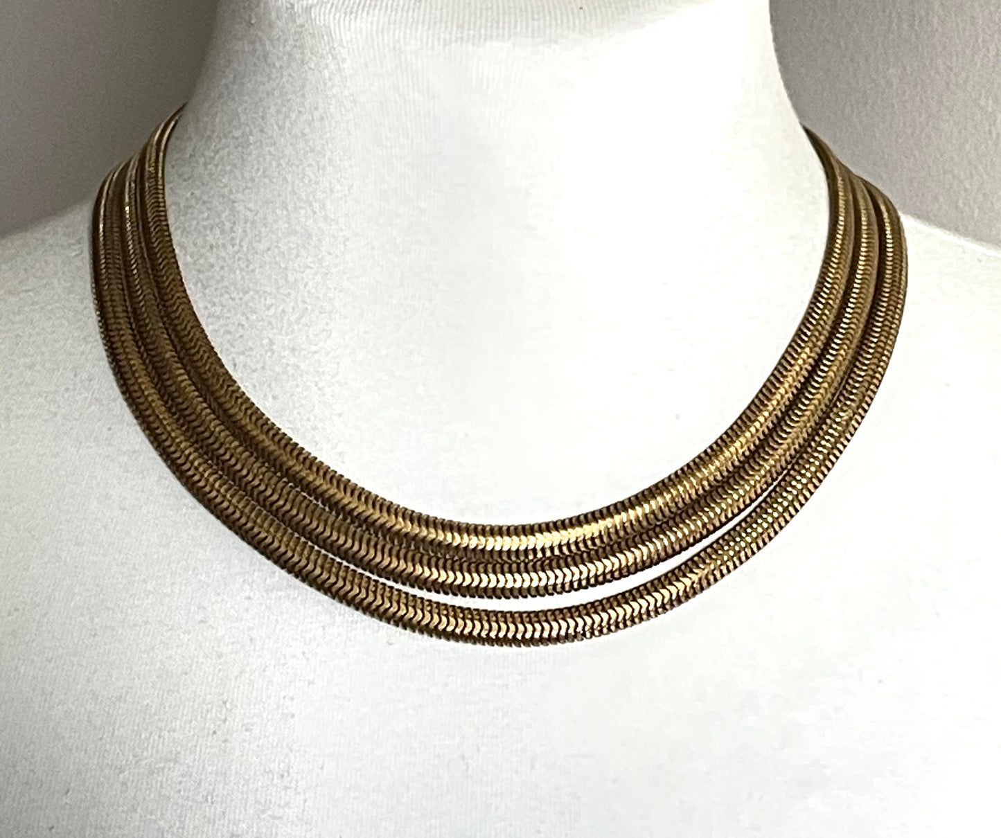 Vintage Art Deco machine age repousse bow clasp triple strand thick gold tone snake chain necklace