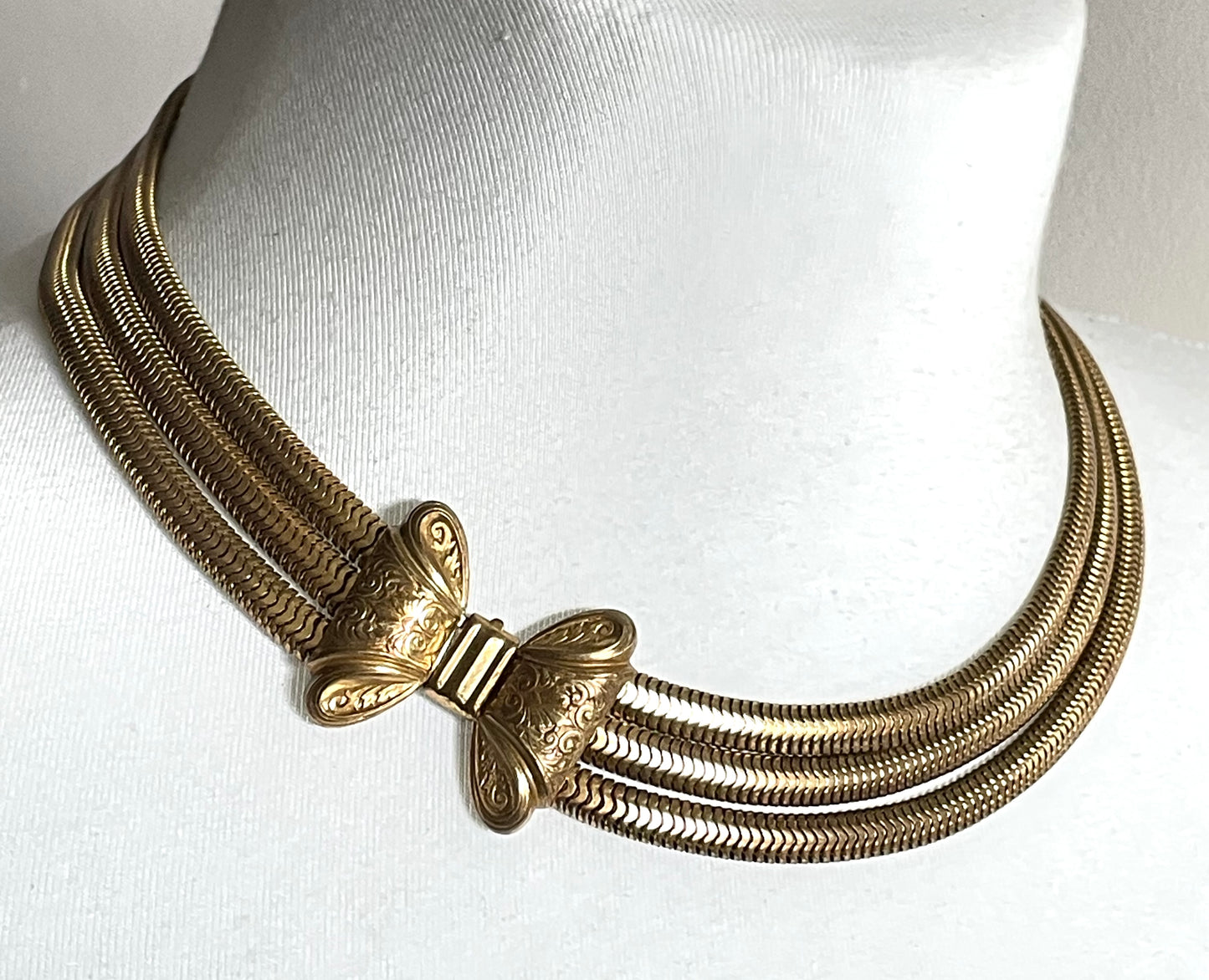 Vintage Art Deco machine age repousse bow clasp triple strand thick gold tone snake chain necklace