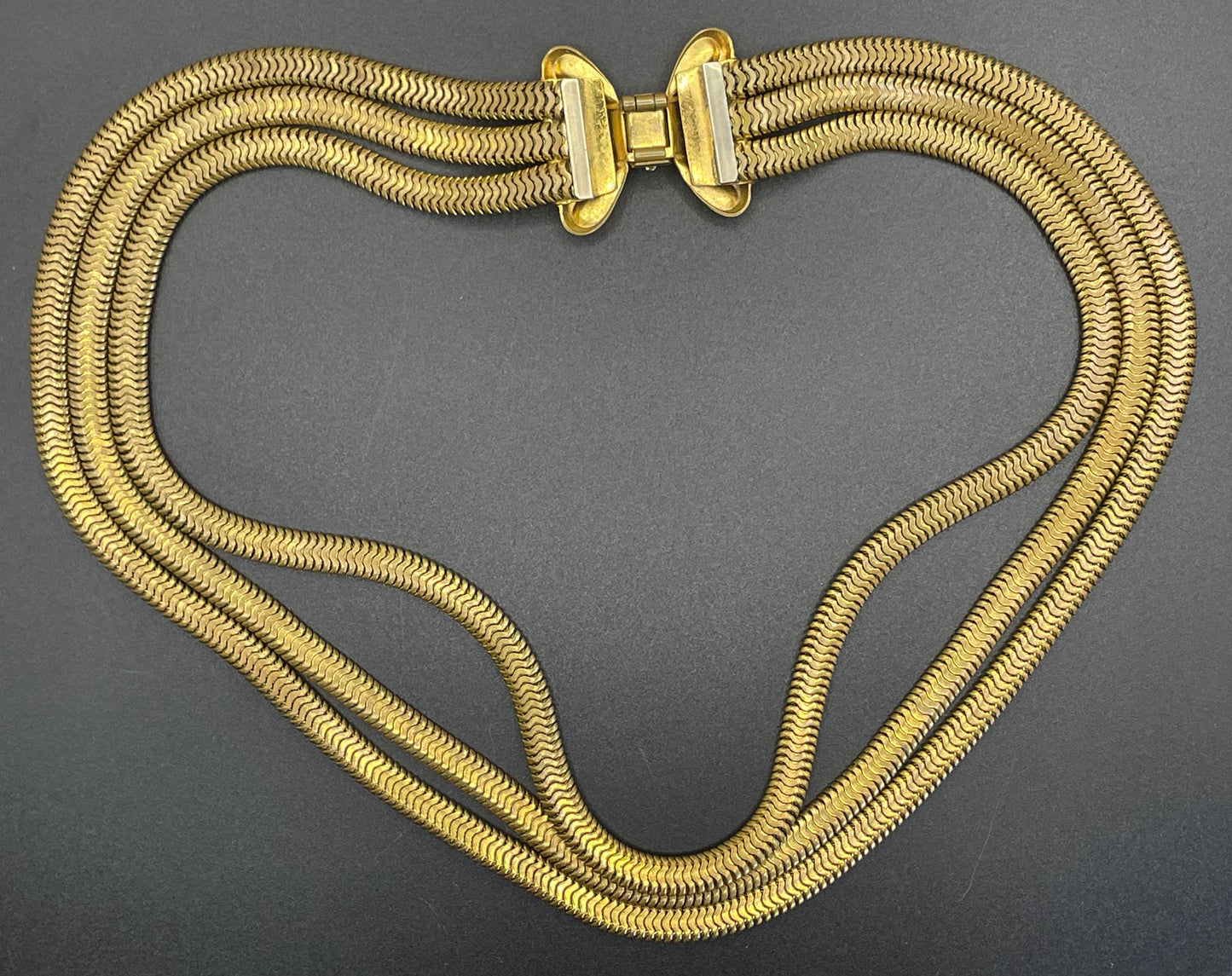 Vintage Art Deco machine age repousse bow clasp triple strand thick gold tone snake chain necklace