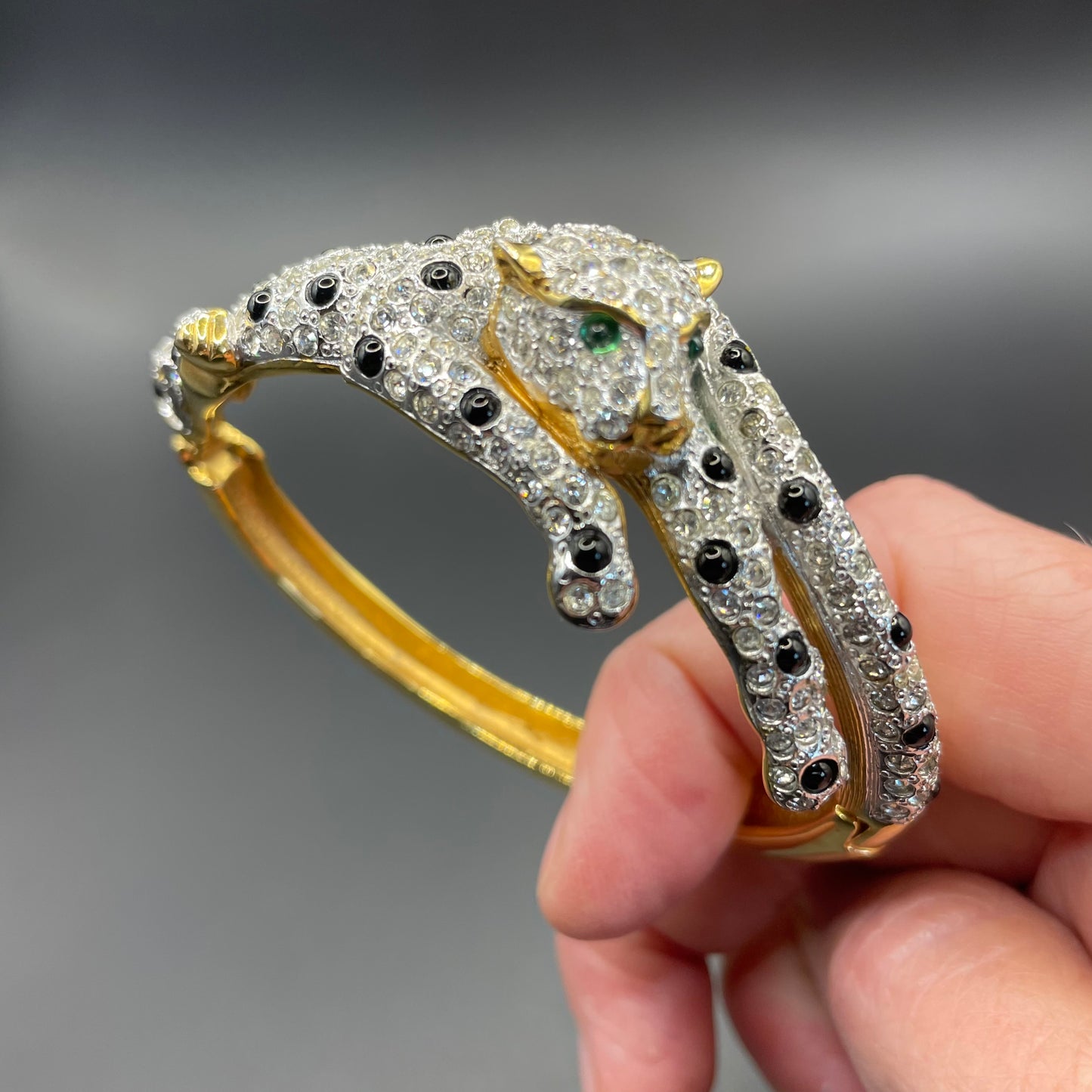 Vintage leopard / panther bangle, gold plated, green and black glass cabochons, clear rhinestones, interesting stamp signature