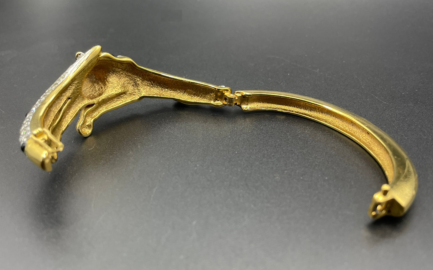 Vintage leopard / panther bangle, gold plated, green and black glass cabochons, clear rhinestones, interesting stamp signature