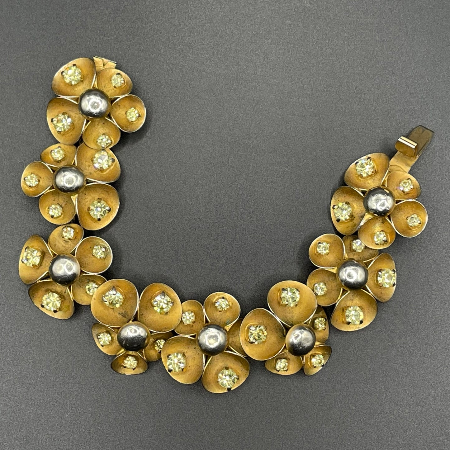 Vintage ornate floral bracelet, heavy moulded gold tone petals gold tone metal cabochon centres & yellow rhinestones, possible Haskell