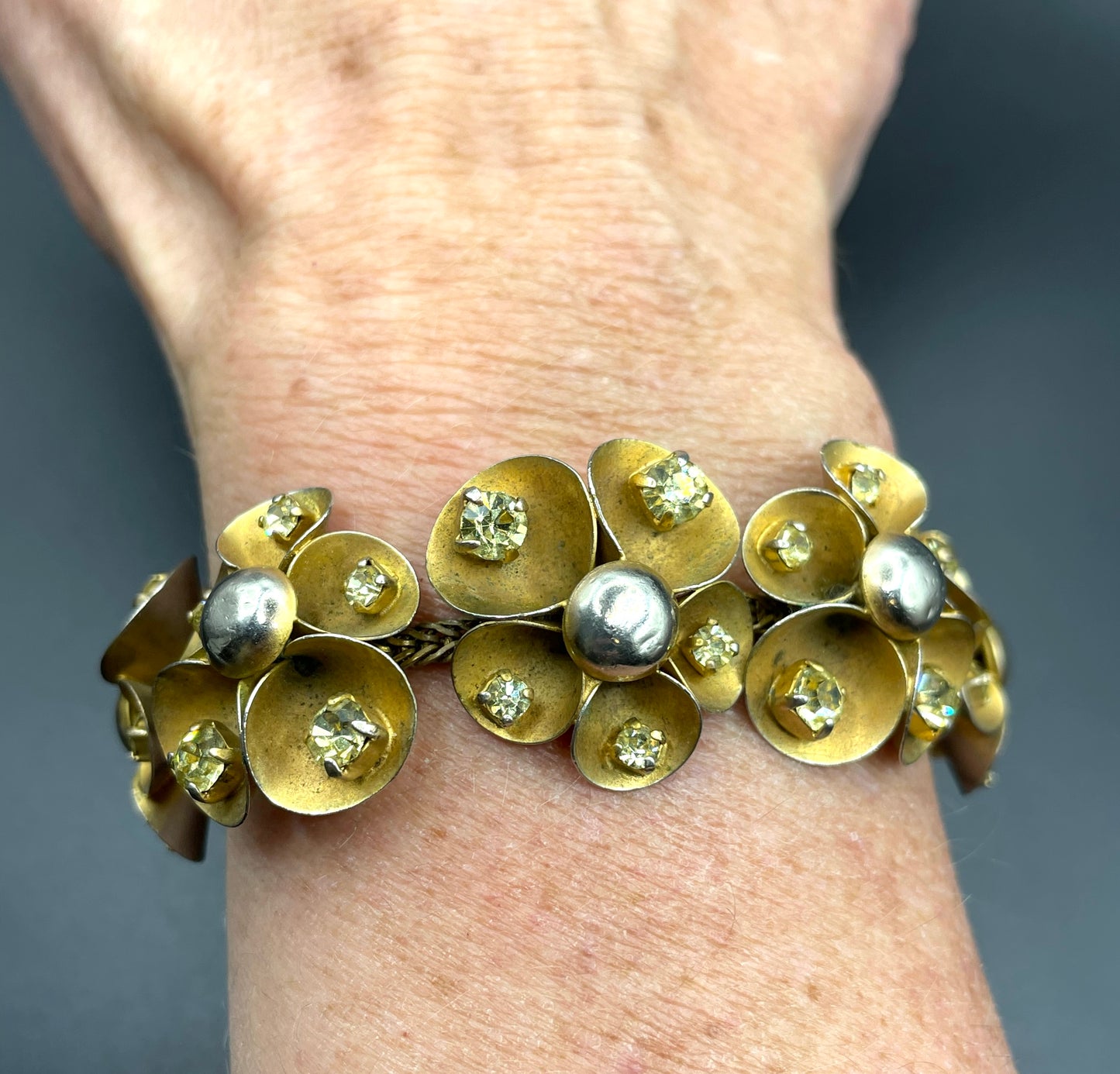 Vintage ornate floral bracelet, heavy moulded gold tone petals gold tone metal cabochon centres & yellow rhinestones, possible Haskell