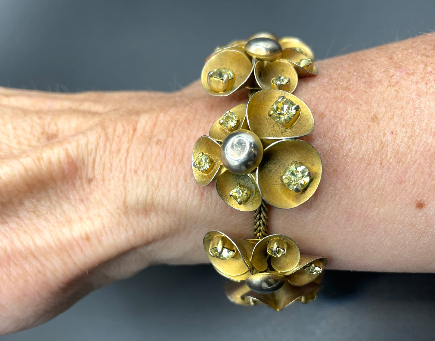 Vintage ornate floral bracelet, heavy moulded gold tone petals gold tone metal cabochon centres & yellow rhinestones, possible Haskell