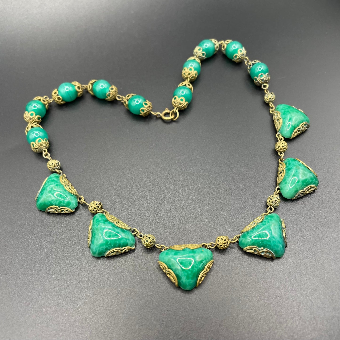 Vintage Art Deco Czech green Peking glass and gold tone filigree necklace, possibly Neiger Brothers (Max and Norbert)