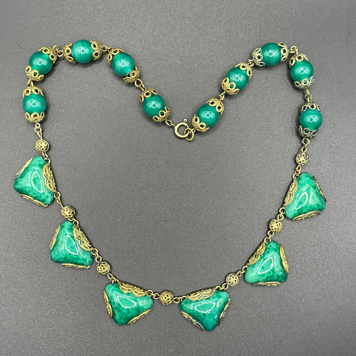 Vintage Art Deco Czech green Peking glass and gold tone filigree necklace, possibly Neiger Brothers (Max and Norbert)