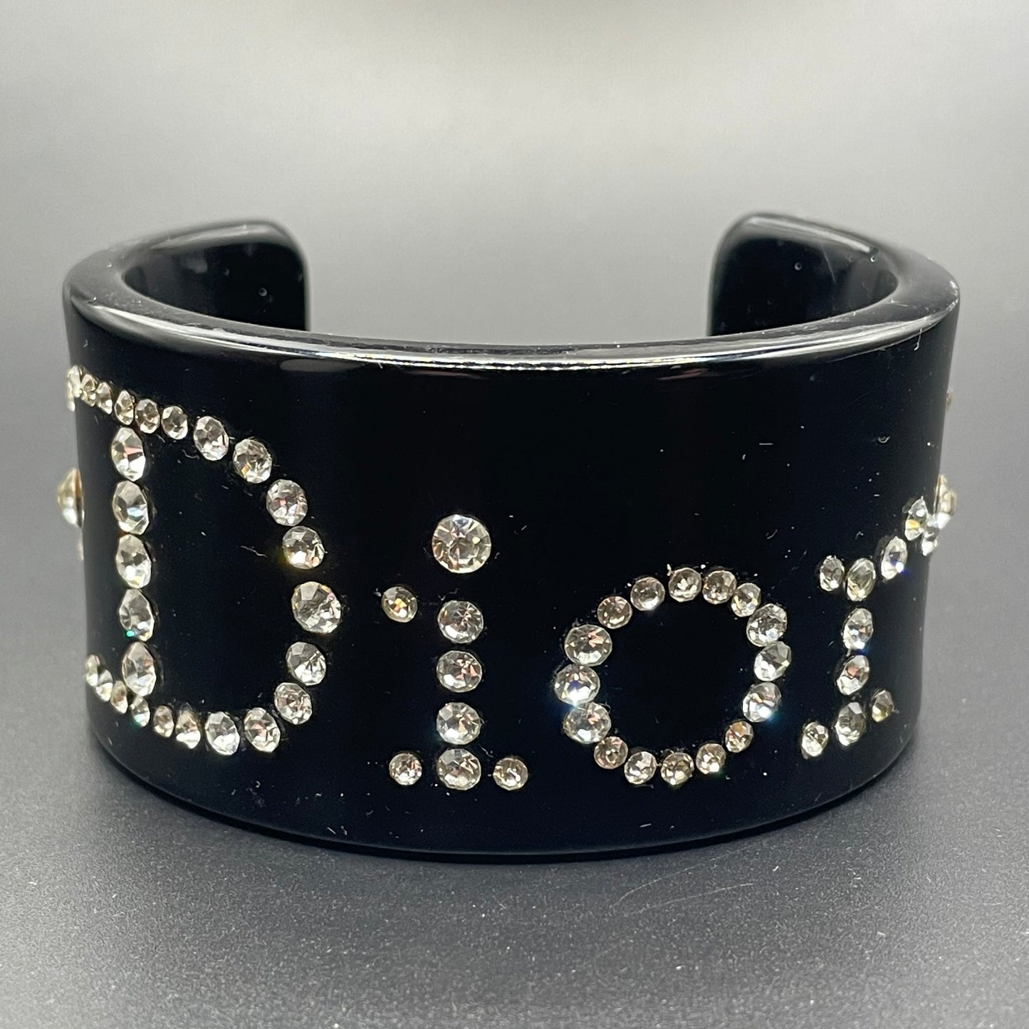 Vintage Christian Dior classic black plastic and clear crystal rhinestone logo cuff bangle