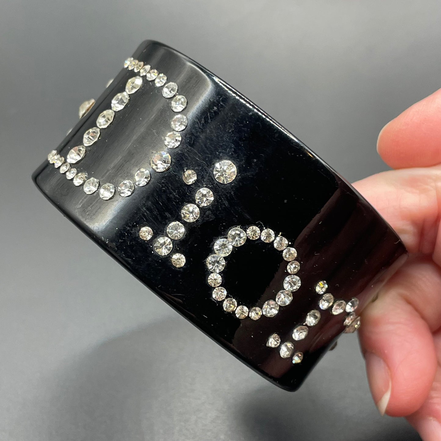 Vintage Christian Dior classic black plastic and clear crystal rhinestone logo cuff bangle
