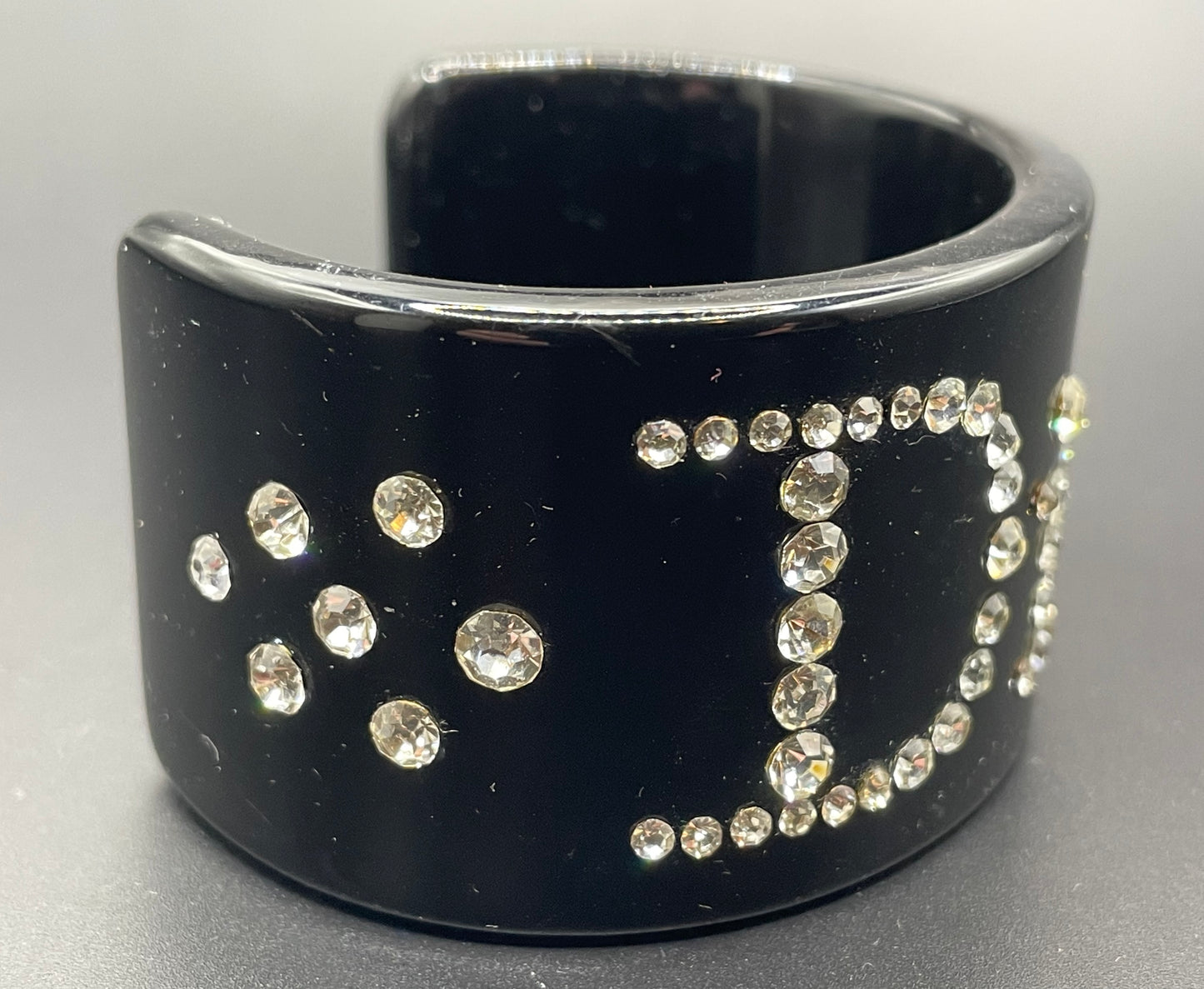 Vintage Christian Dior classic black plastic and clear crystal rhinestone logo cuff bangle