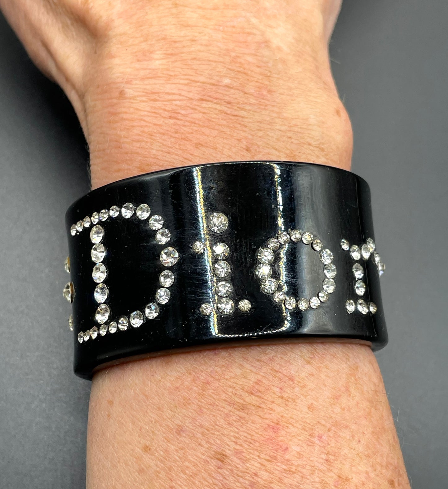 Vintage Christian Dior classic black plastic and clear crystal rhinestone logo cuff bangle