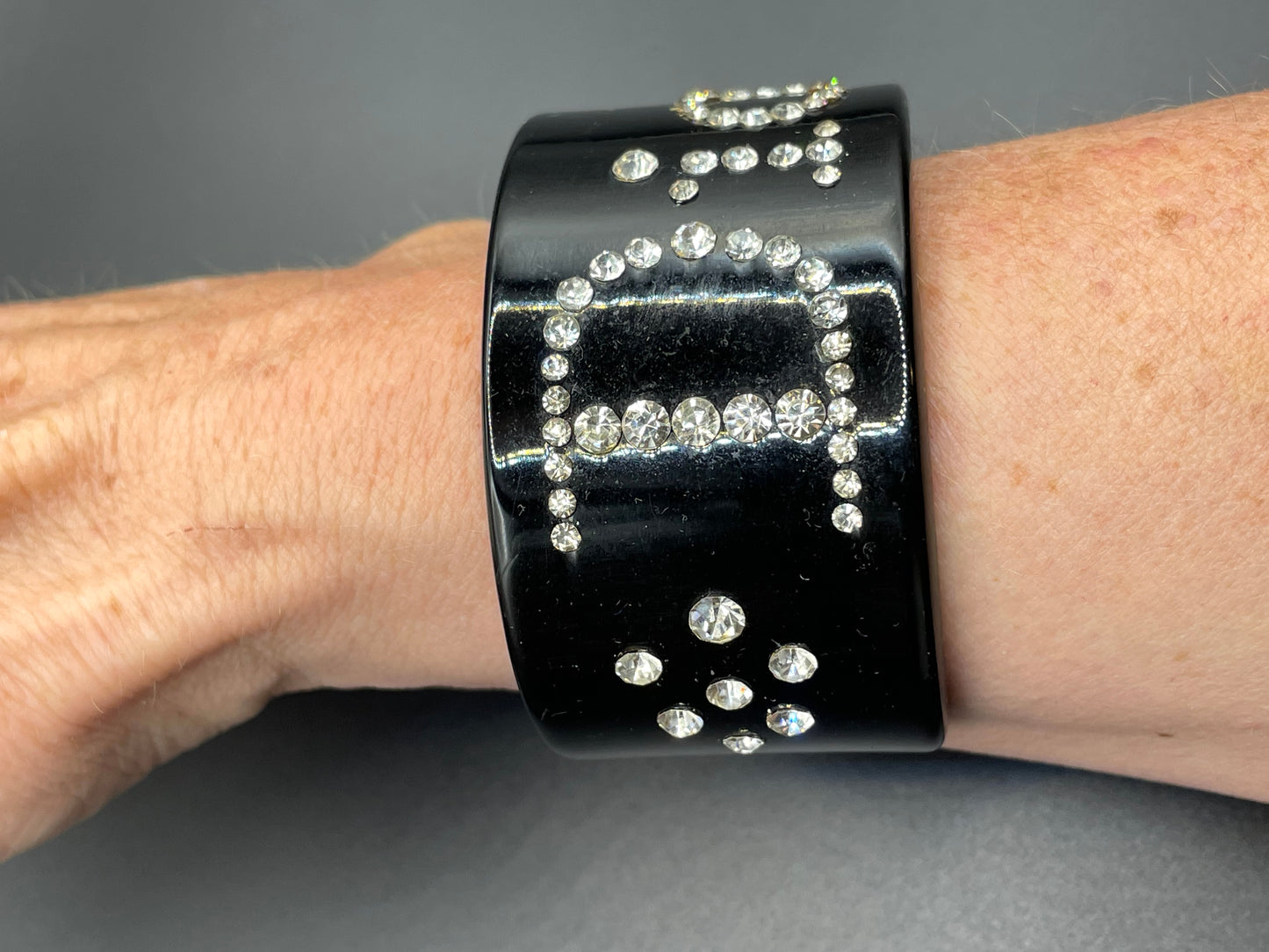 Vintage Christian Dior classic black plastic and clear crystal rhinestone logo cuff bangle