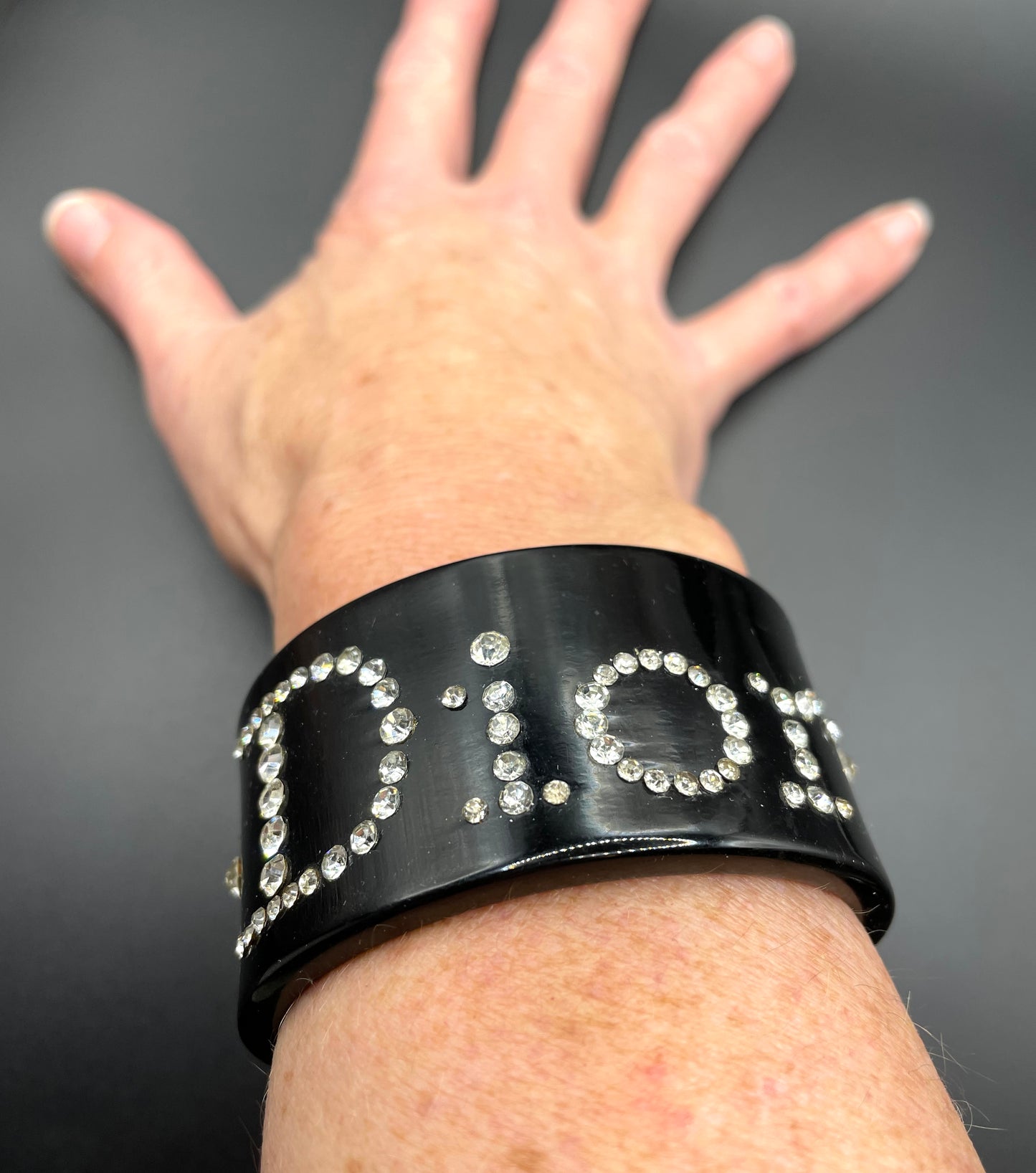 Vintage Christian Dior classic black plastic and clear crystal rhinestone logo cuff bangle