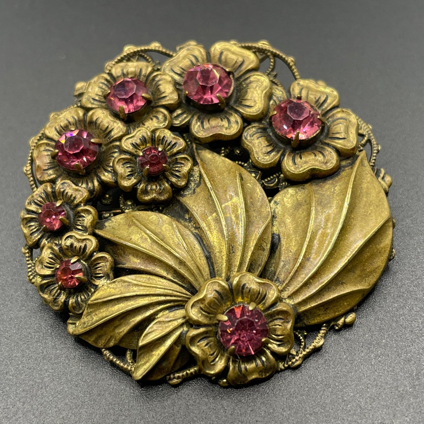 Vintage Art Deco Czech pink rhinestone brooch in a gorgeous gold tone floral and leaf design