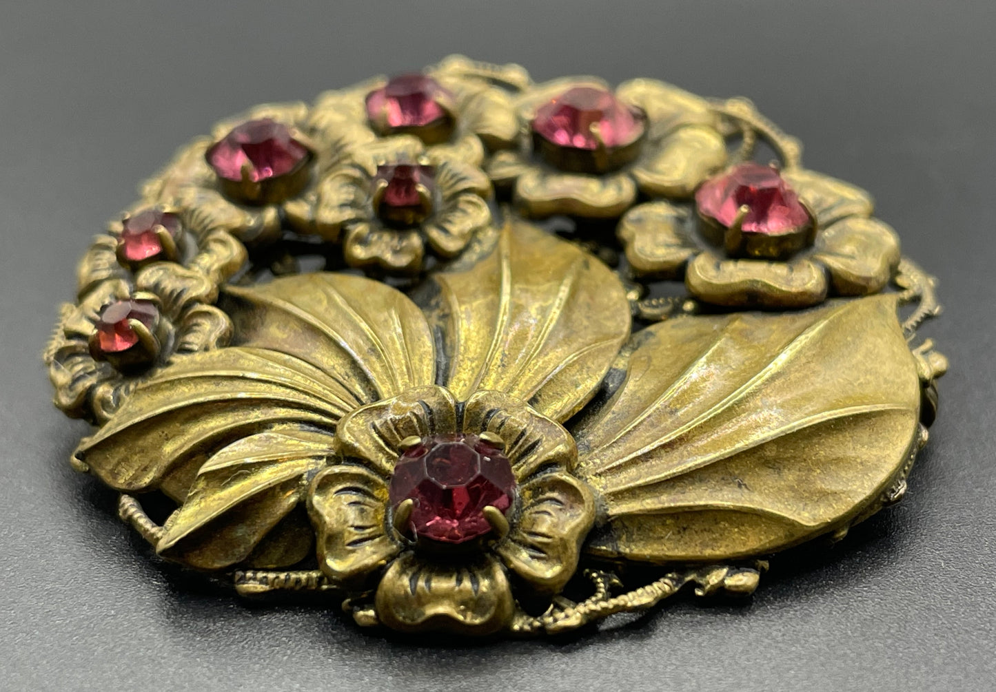 Vintage Art Deco Czech pink rhinestone brooch in a gorgeous gold tone floral and leaf design