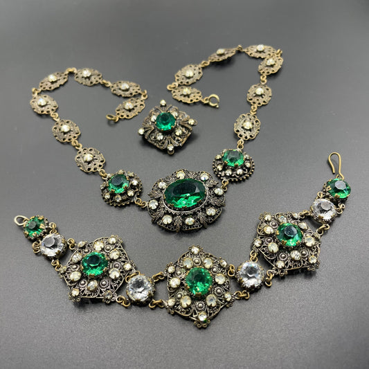 Vintage Art Deco Czech emerald green and clear glass rhinestone and gold tone filigree necklace, bracelet and brooch set, possibly Neiger