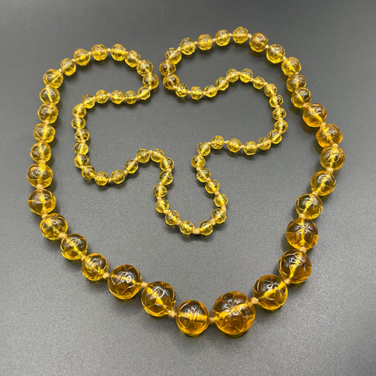 Vintage moulded pressed glass citrine yellow / orange graduated bead flapper necklace mid to longer length