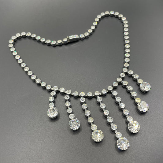 Vintage Art Deco clear paste crystal silver tone riviere fringe necklace with collet set rhinestones