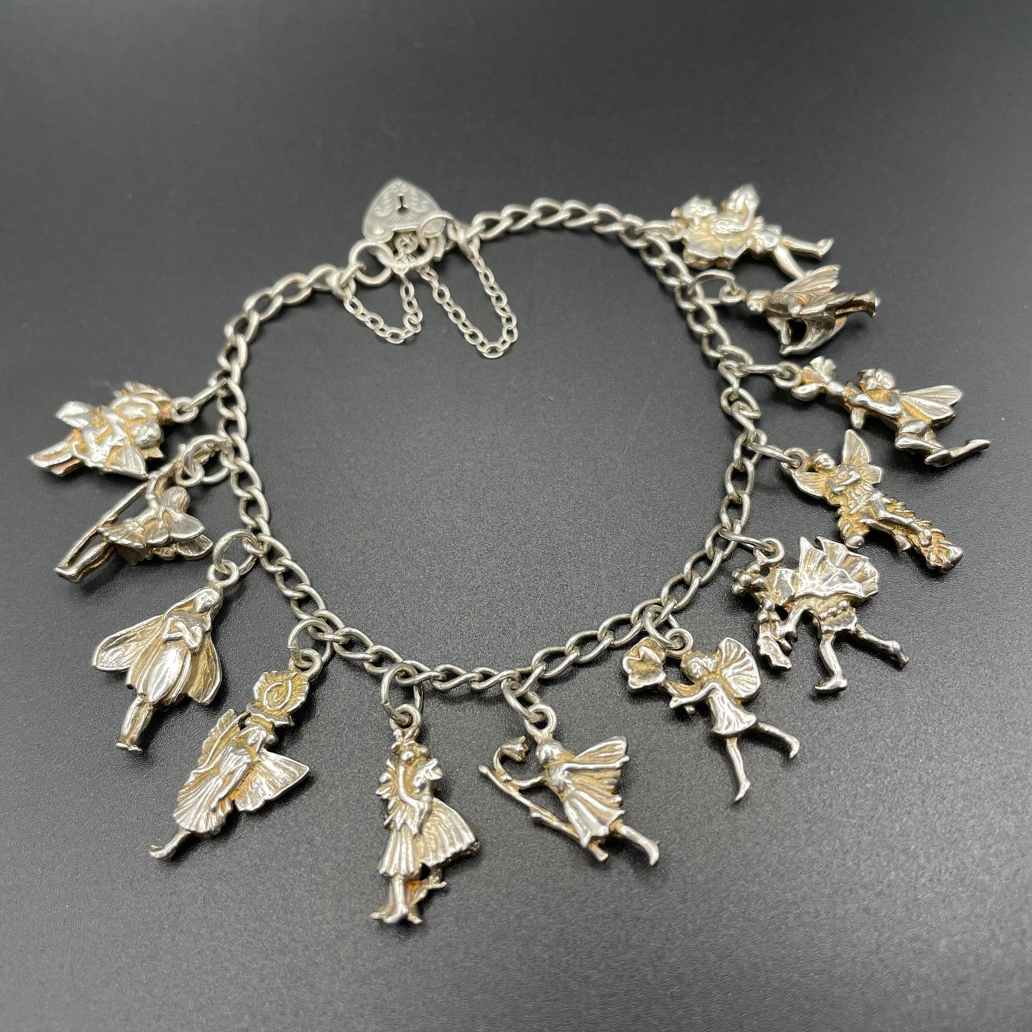 Vintage Cicely Mary Barker Flower Fairies 925 sterling silver fairy charm bracelet hallmarked by ASJ jewellers, 25 grams