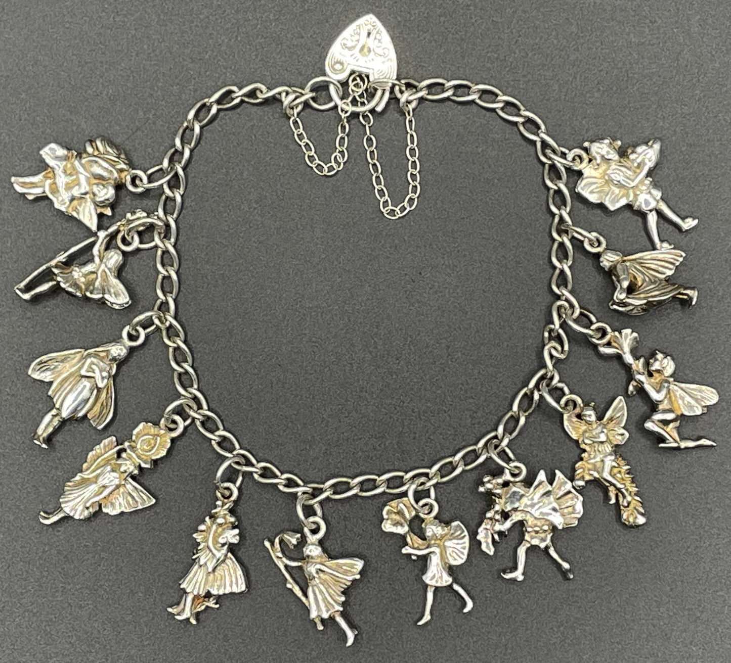 Vintage Cicely Mary Barker Flower Fairies 925 sterling silver fairy charm bracelet hallmarked by ASJ jewellers, 25 grams