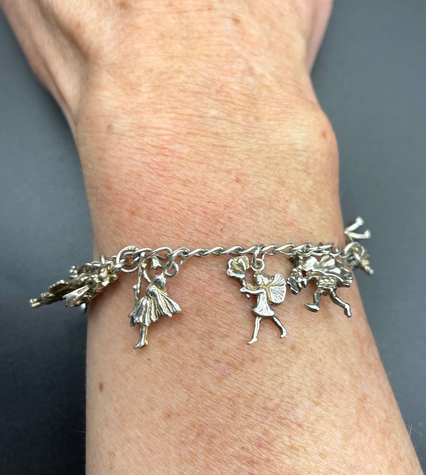 Vintage Cicely Mary Barker Flower Fairies 925 sterling silver fairy charm bracelet hallmarked by ASJ jewellers, 25 grams