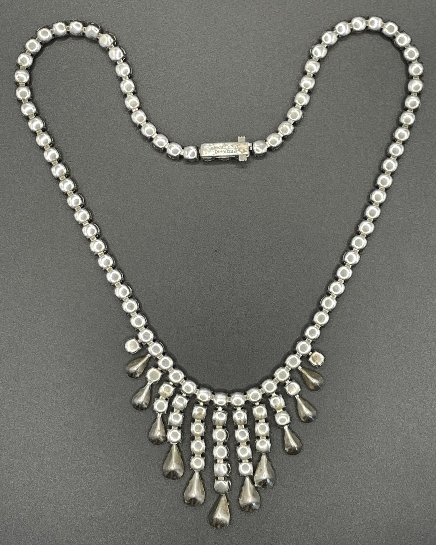Vintage sterling silver stamped 'ster silver' ice clear rhinestone fringe necklace, signed 'prov pat'
