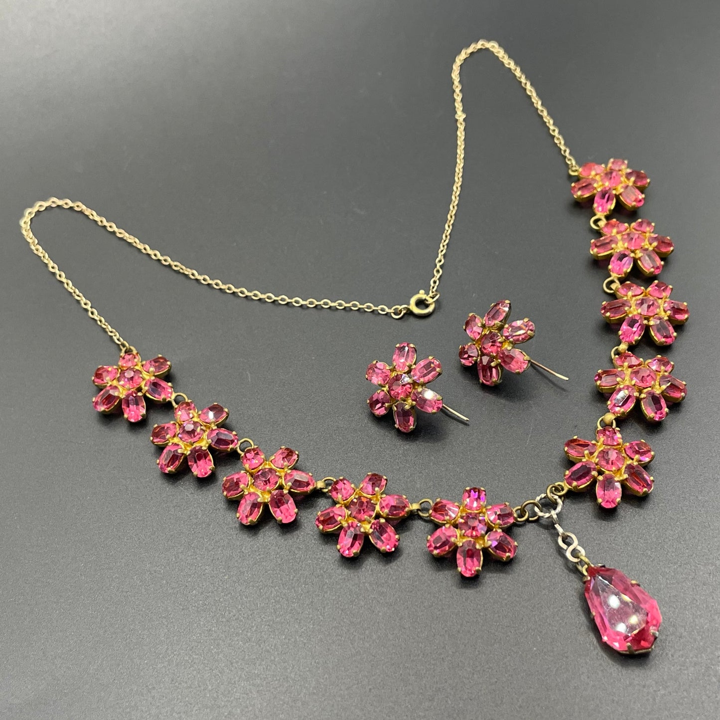 Vintage crystal floral design pink ruby coloured rhinestone necklace and earrings set- bright rhinestones set open-backed in gold tone
