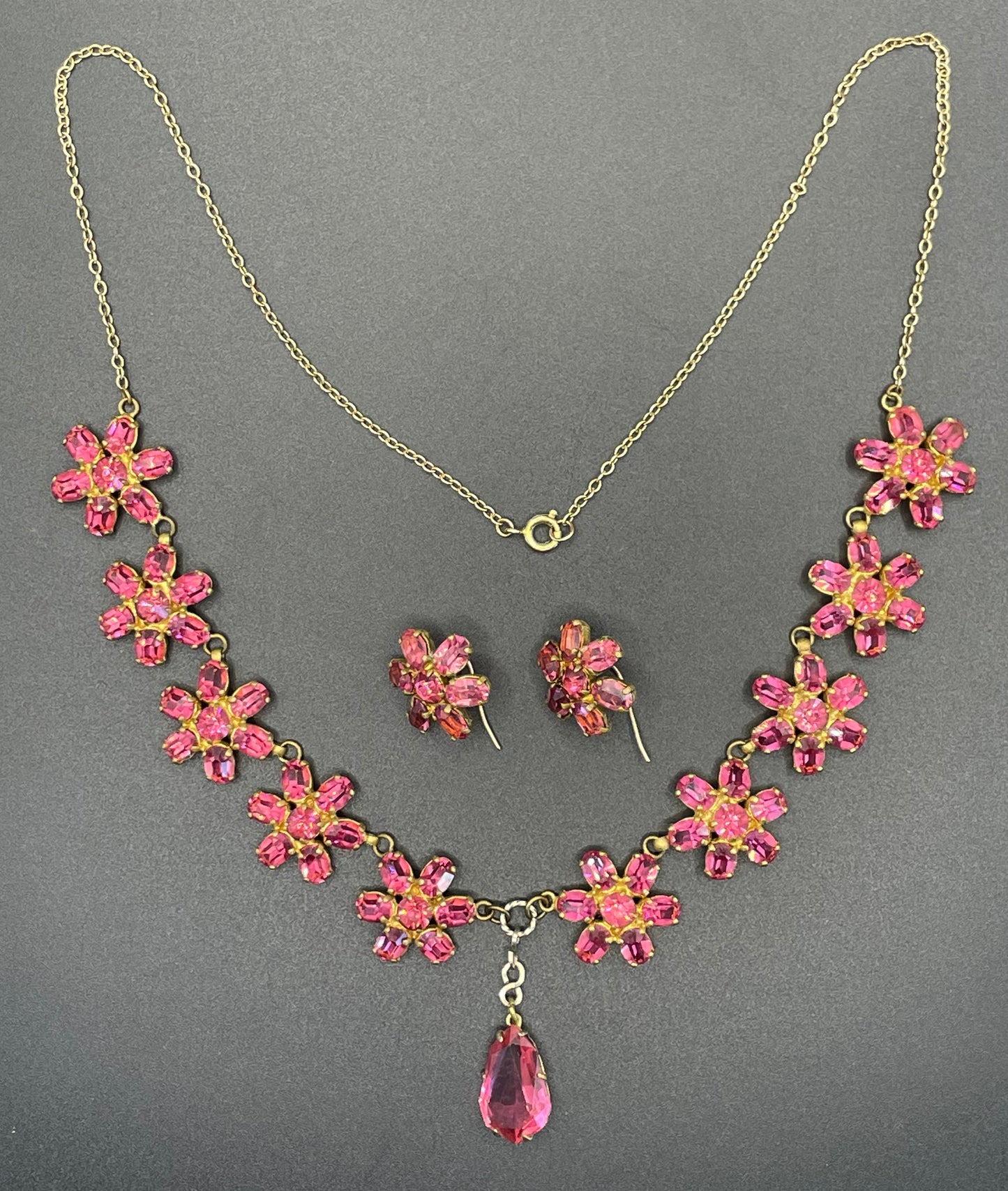 Vintage crystal floral design pink ruby coloured rhinestone necklace and earrings set- bright rhinestones set open-backed in gold tone