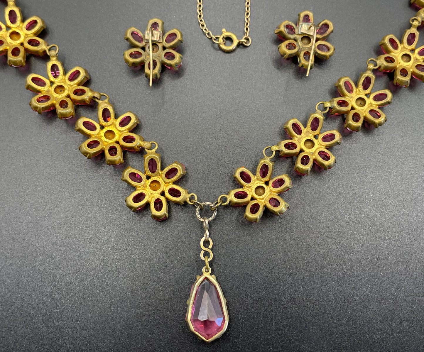 Vintage crystal floral design pink ruby coloured rhinestone necklace and earrings set- bright rhinestones set open-backed in gold tone