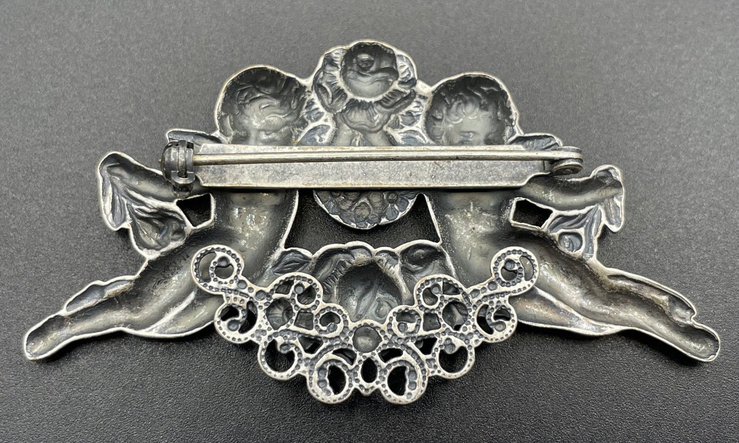 Possibly early Askew London, vintage cherub cupid floral brooch in antique silver tone