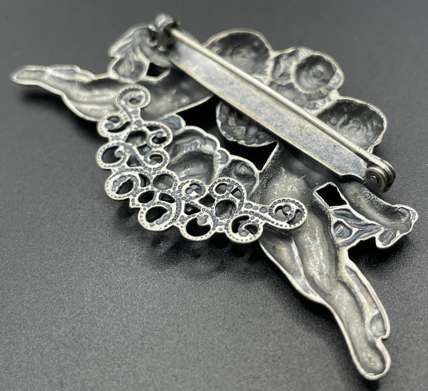 Possibly early Askew London, vintage cherub cupid floral brooch in antique silver tone