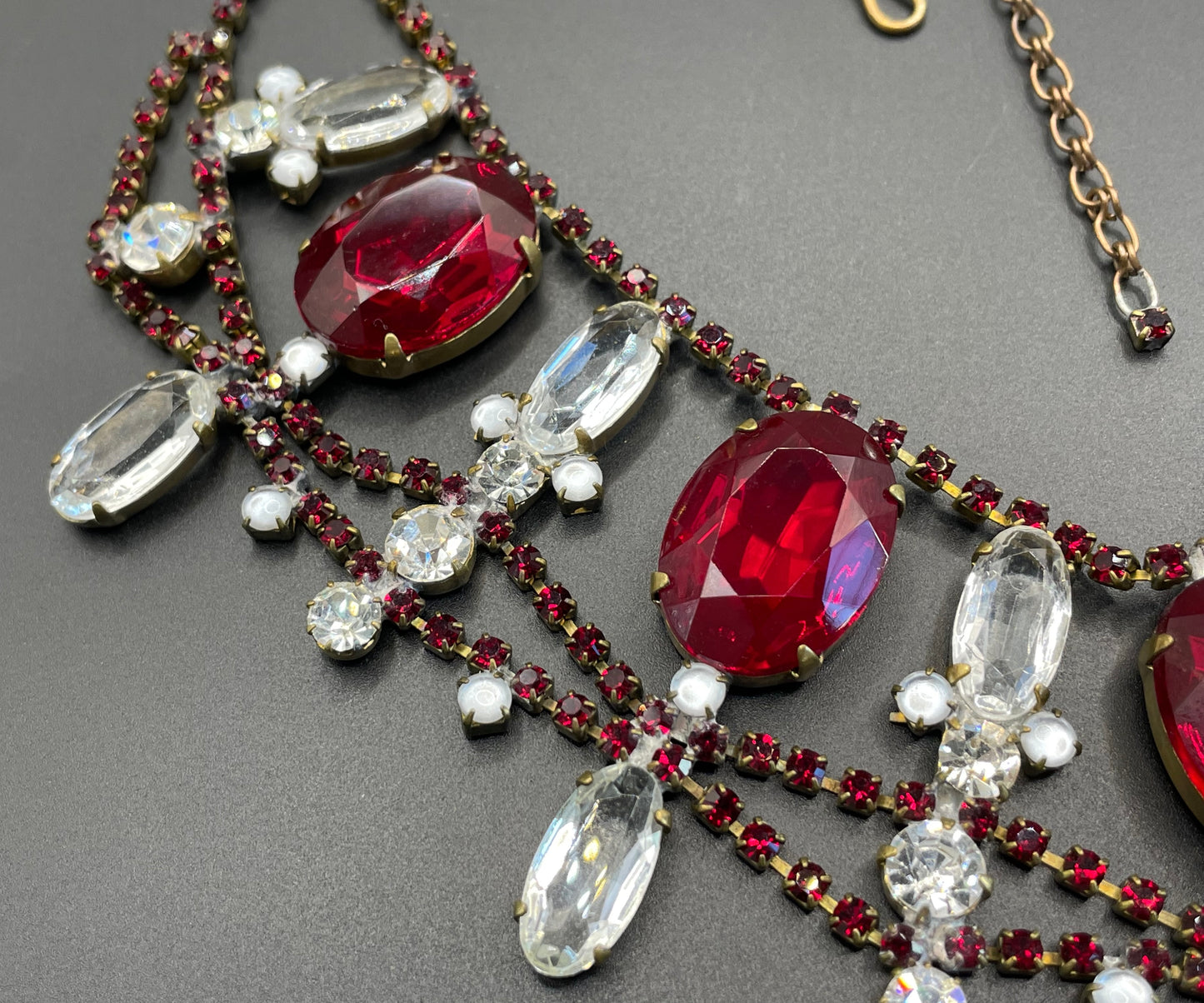 Huge vintage rhinestone festoon  bib necklace, large ice clear and garnet red vibrant Czech rhinestones, a heavy glass showstopping piece